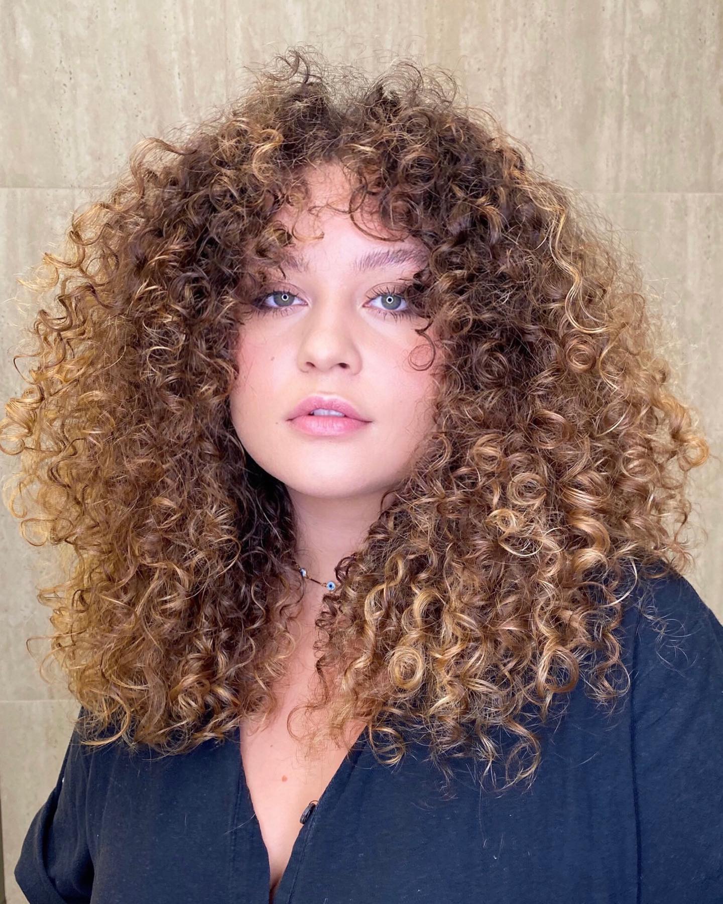 Layered Natural Curls for Chubby Cheeks