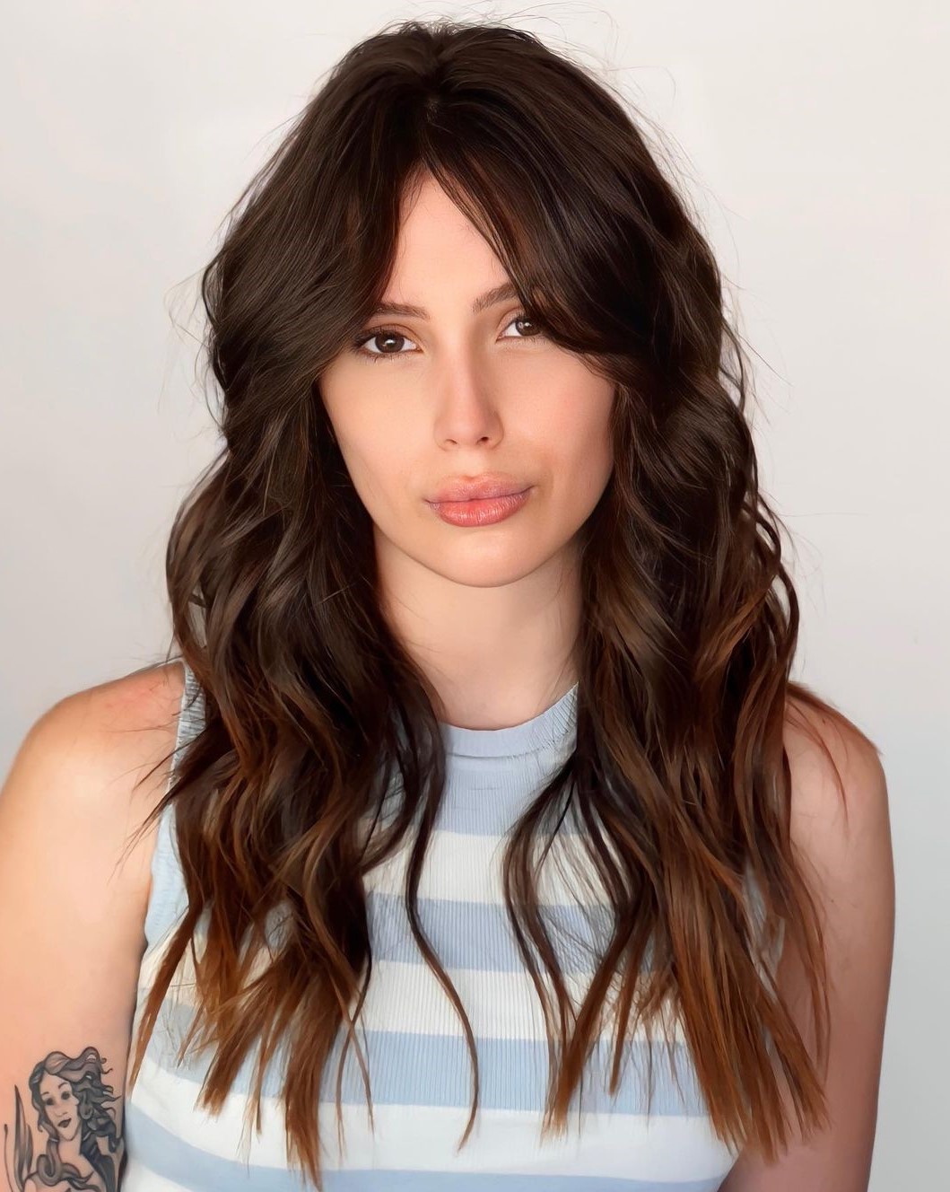 Long Wavy Hairstyle with Curtain Bangs